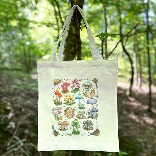 A tote bag featuring an illustration of mushrooms and snails