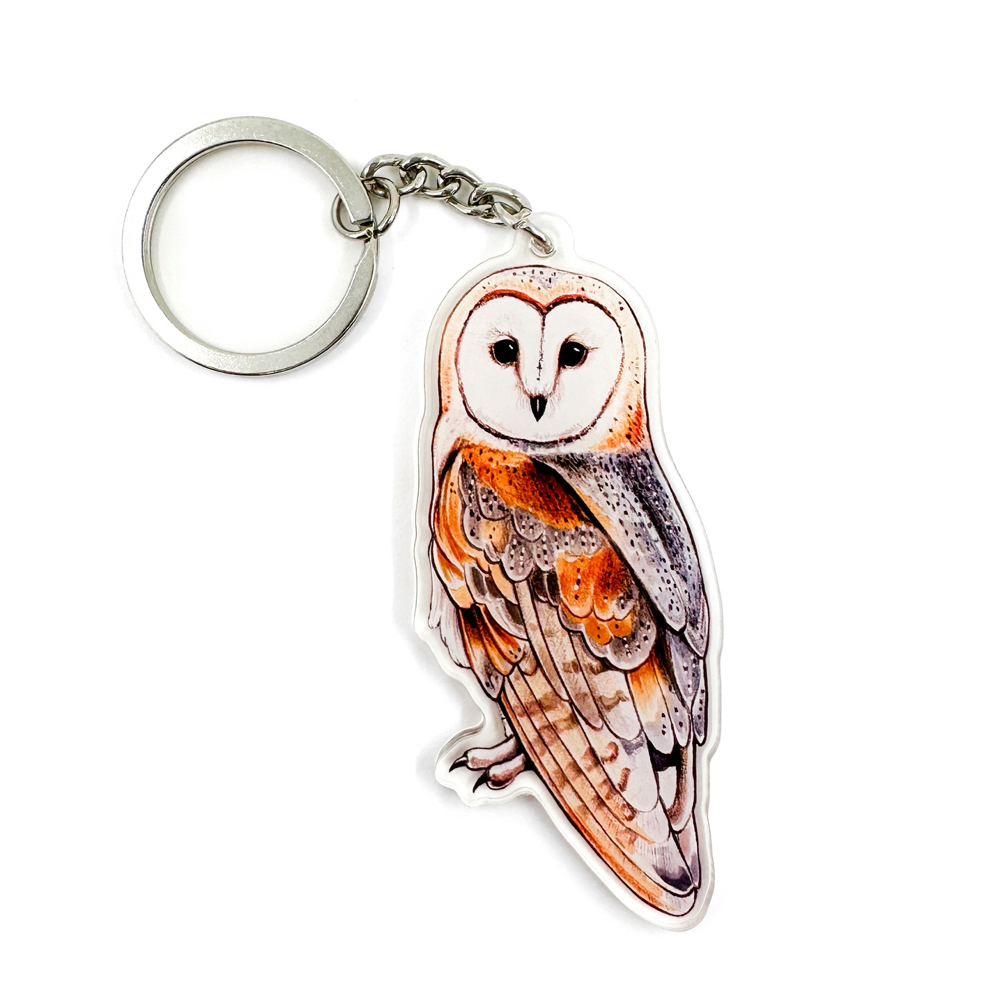 A keychain featuring a barn owl