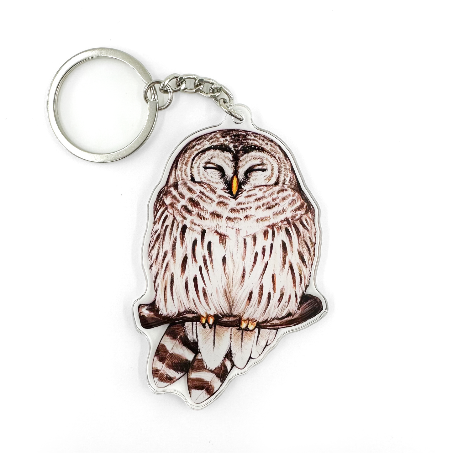 A keychain featuring a barred owl