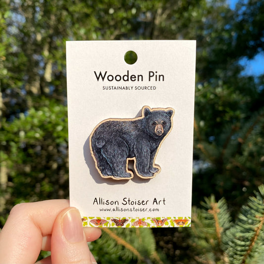 A wooden pin of an American black bear