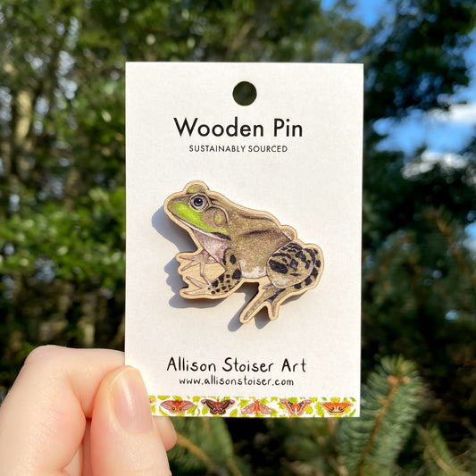 A wooden pin of an American bullfrog