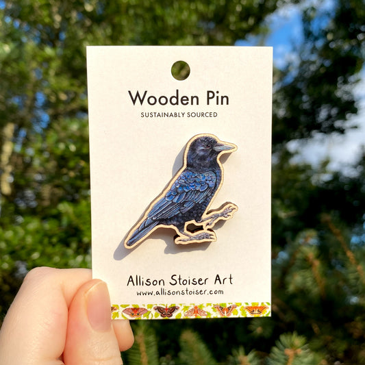 A wooden pin of an American crow