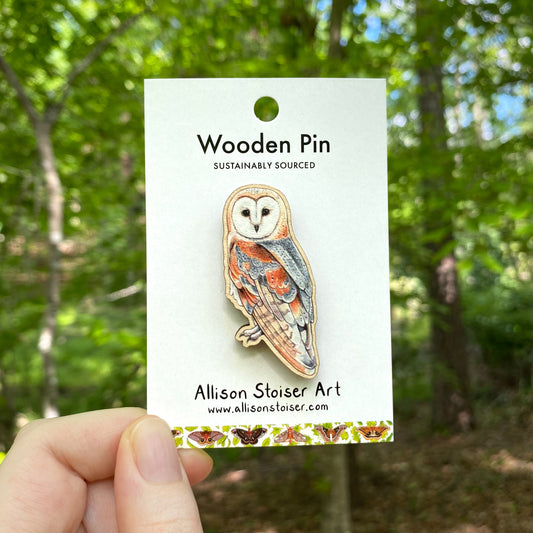A wooden pin of a barn owl