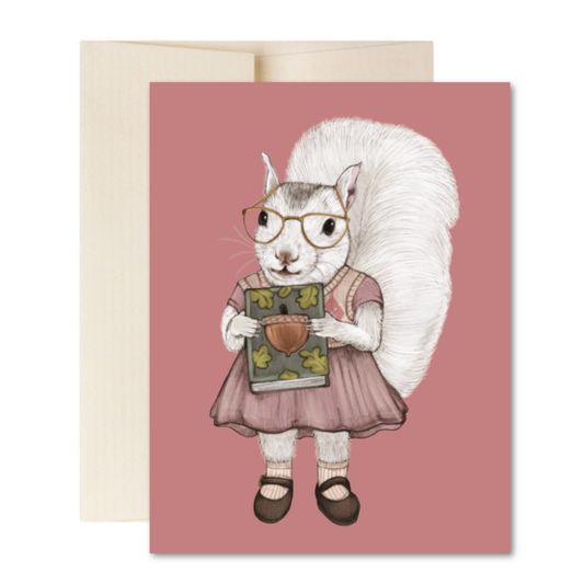 Greeting card with a squirrel wearing glasses and a dress holding a book with an acorn on a pink background.