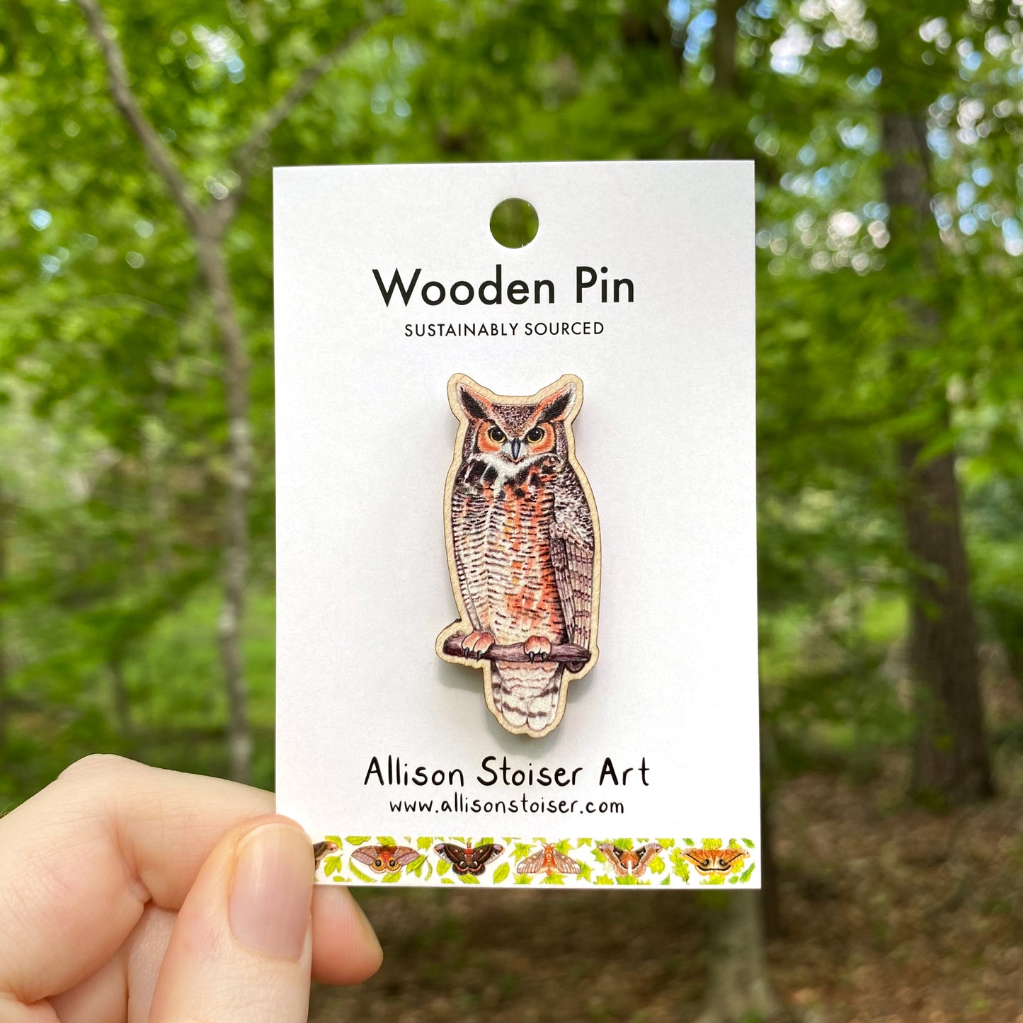 A wooden pin of a great horned owl