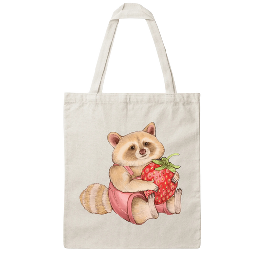 A tote bag of a blond raccoon in pink overalls holding a strawberry on a white background on a white background.