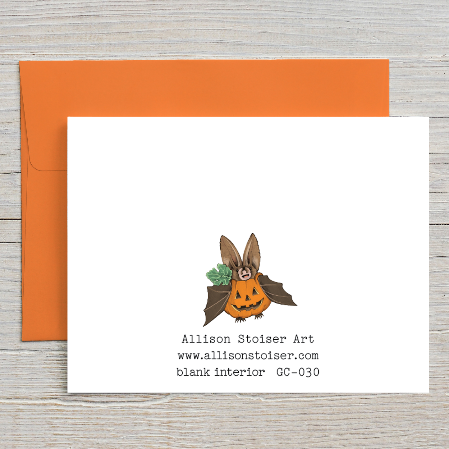 This rear view of this Halloween card features my illustration of a trick-or-bat dressed as a pumpkin.