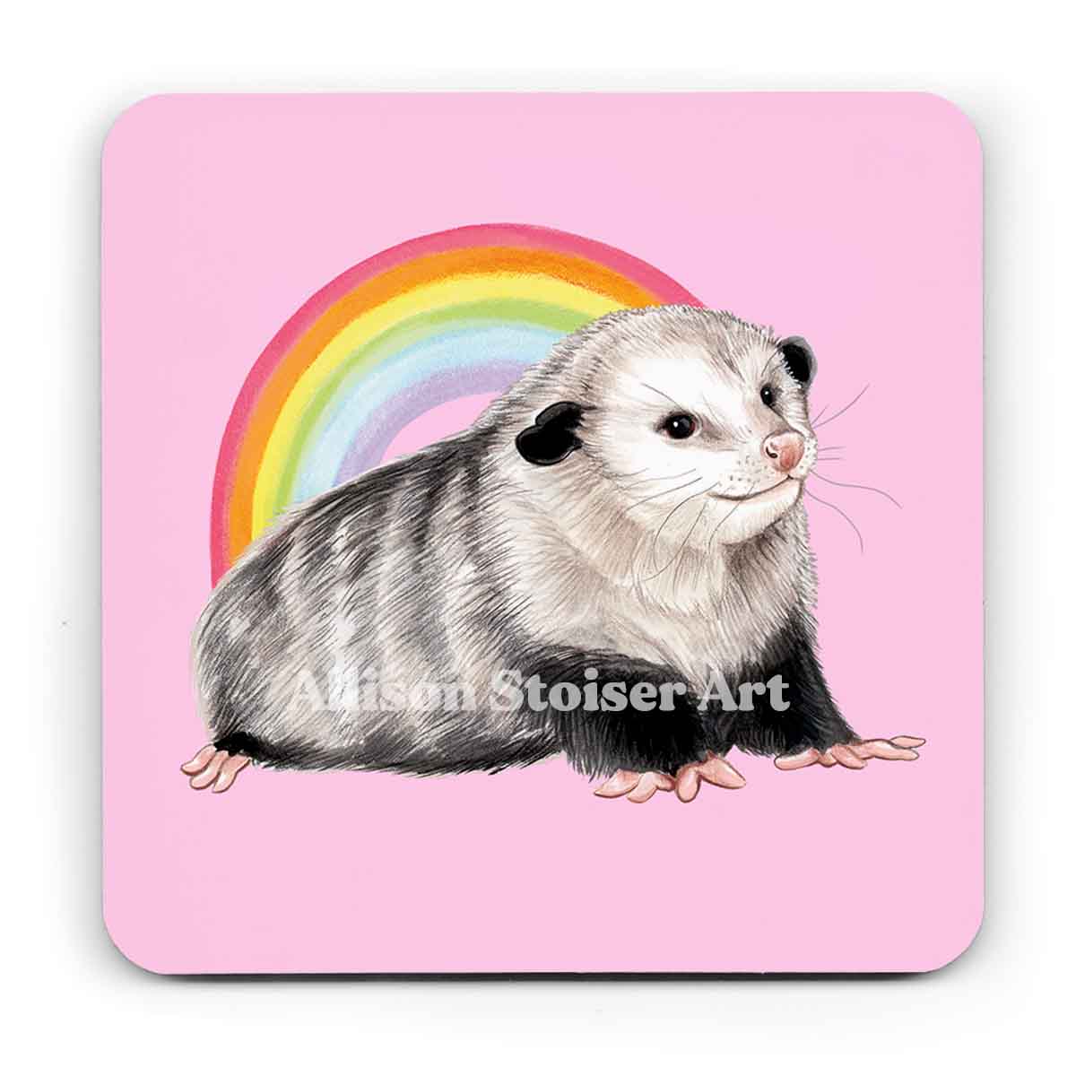 A light pink coaster of an opossum standing in front of a rainbow on a white background.