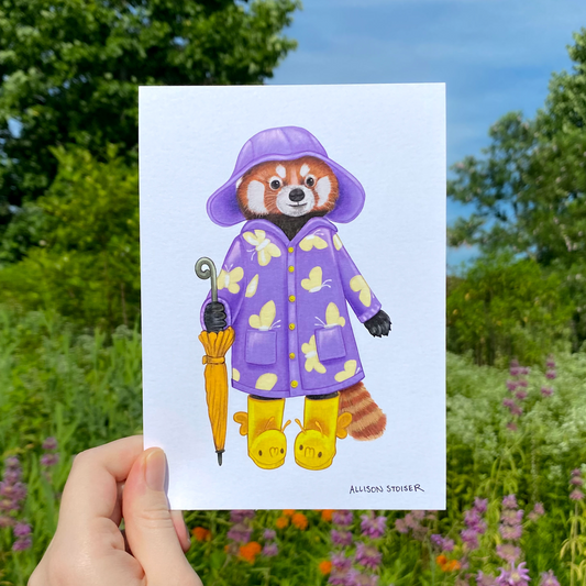 Illustration of a red panda in a purple raincoat and yellow boots holding an umbrella, held in front of a natural background.