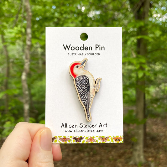 A wooden pin of a red-bellied woodpecker