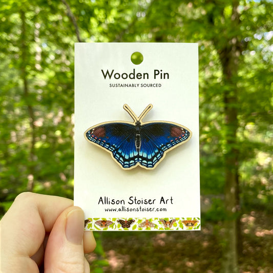 A wooden pin of a red-spotted purple butterfly