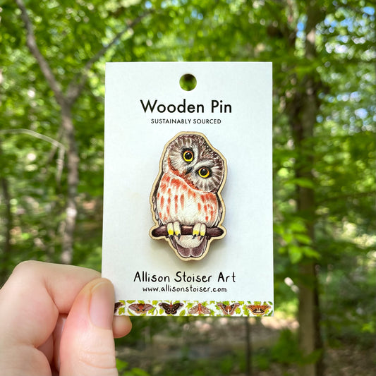 A wooden pin of a saw-whet owl