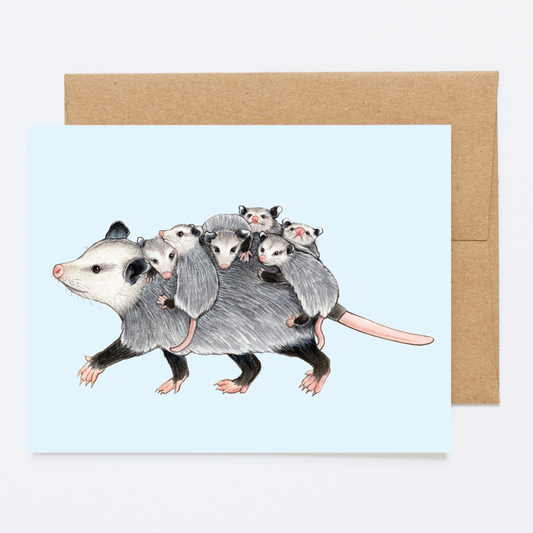 A greeting card with a mom opossum walking with babies on her back.