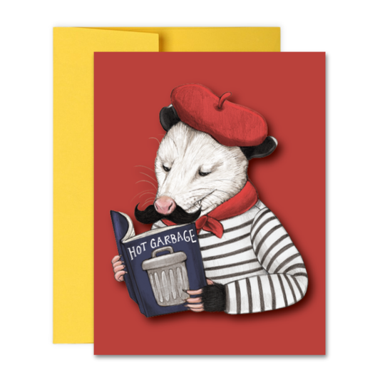 Card with an illustration of an opossum wearing a red beret and holding a book titled 'Hot Garbage' on a red background.
