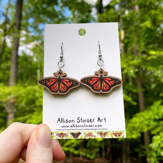 Wooden earrings with small monarch butterfly charms