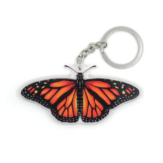 A keychain featuring a monarch butterfly