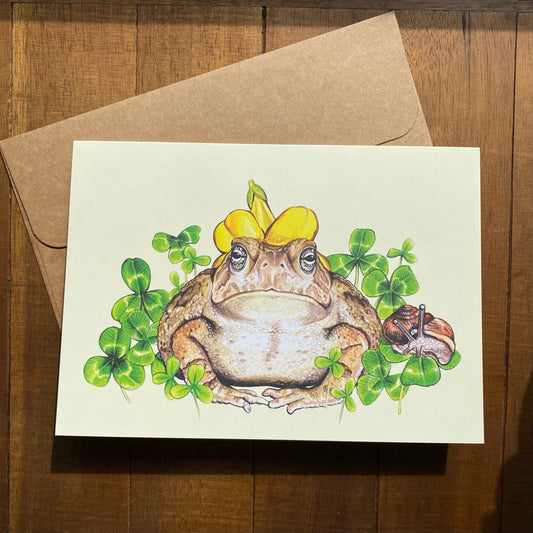 A card featuring a toad wearing a flower hat and his snail companion