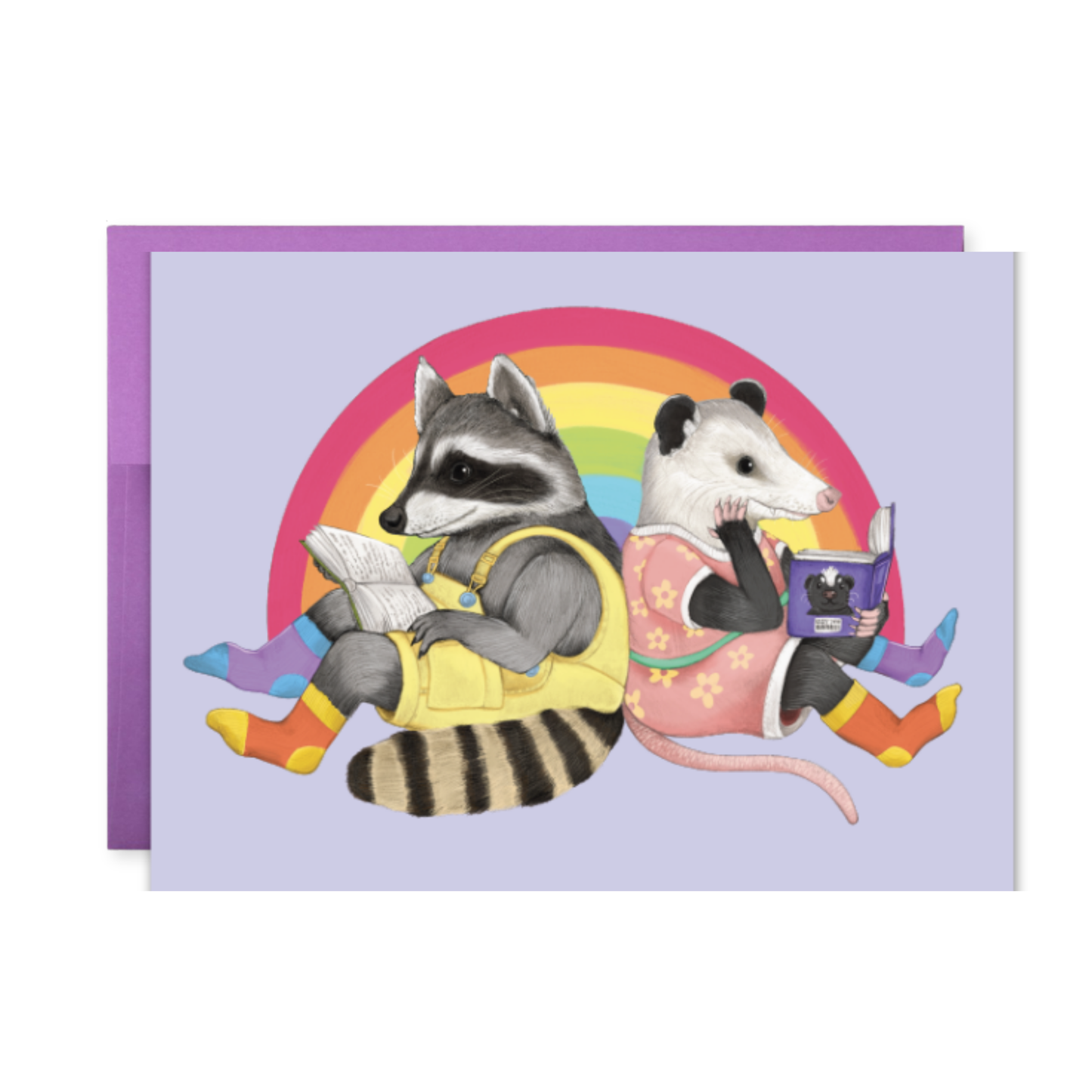 Card with a raccoon and opossum reading books against a rainbow background