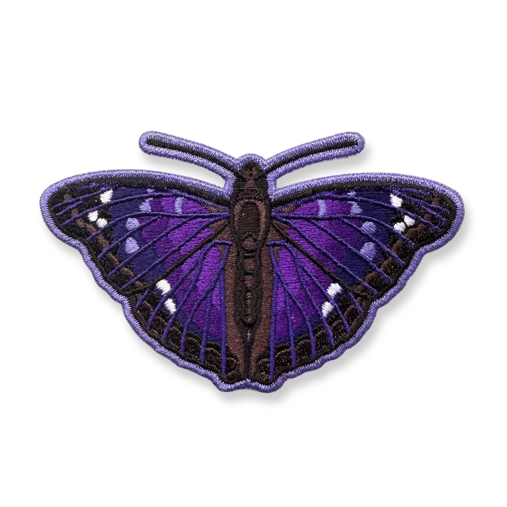 An embroidered Agathina emperor butterfly patch with purple and black wings and small white spots, shown on a plain white background.