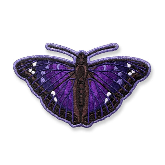 An embroidered Agathina emperor butterfly patch with purple and black wings and small white spots, shown on a plain white background.