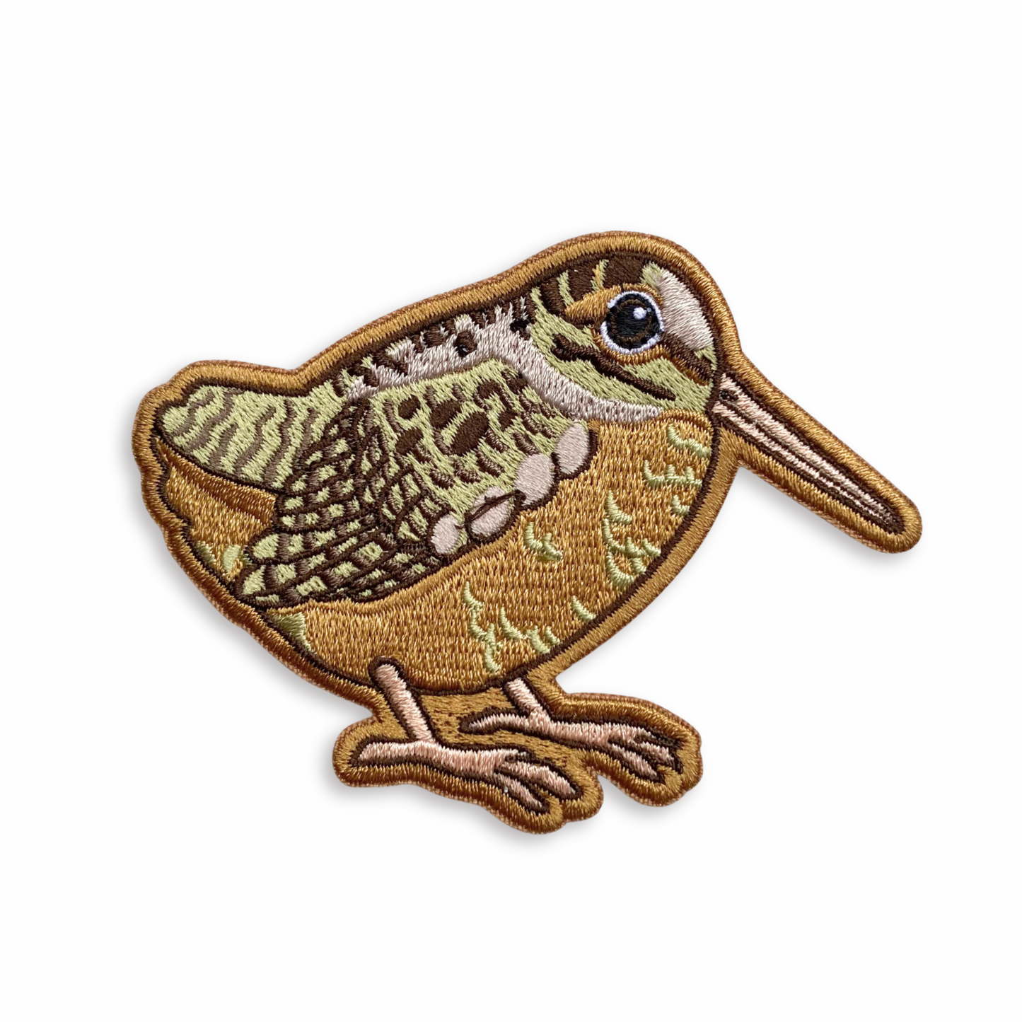 Embroidered patch of a woodcock on a white background