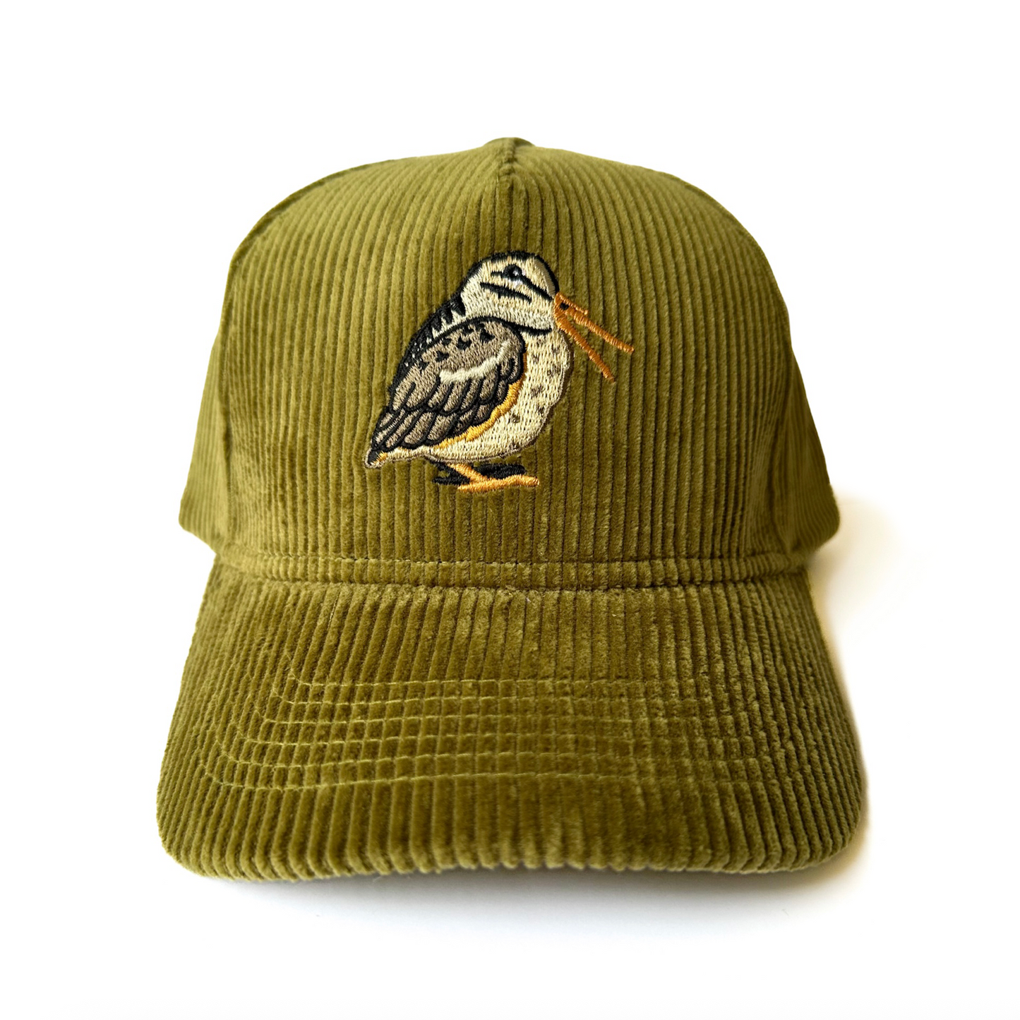 Green corduroy cap with embroidered woodcock design on a white background, there is an extra line of orange over the bird's beak, making it a b-grade.