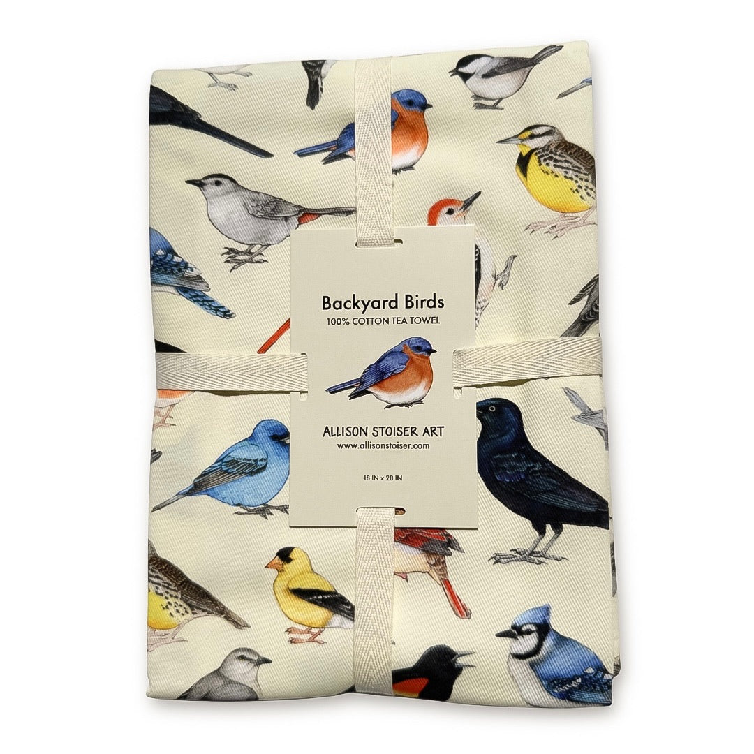 A ribbon-wrapped tea towel featuring backyard birds