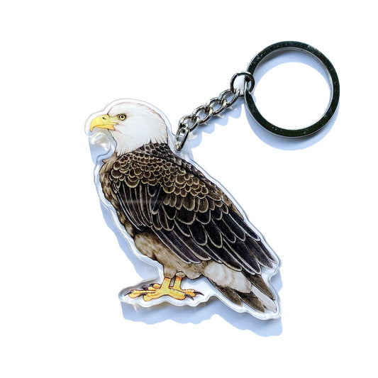 A bald eagle keychain on a white background.