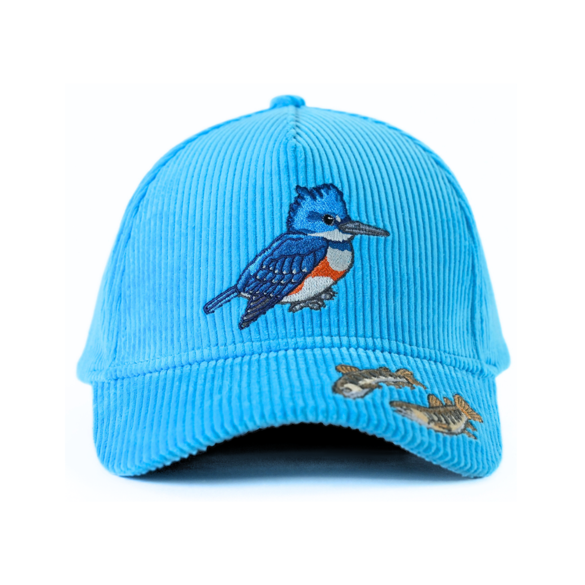 The front of a blue corduroy baseball cap with an embroidered kingfisher and trout fry on a white background.