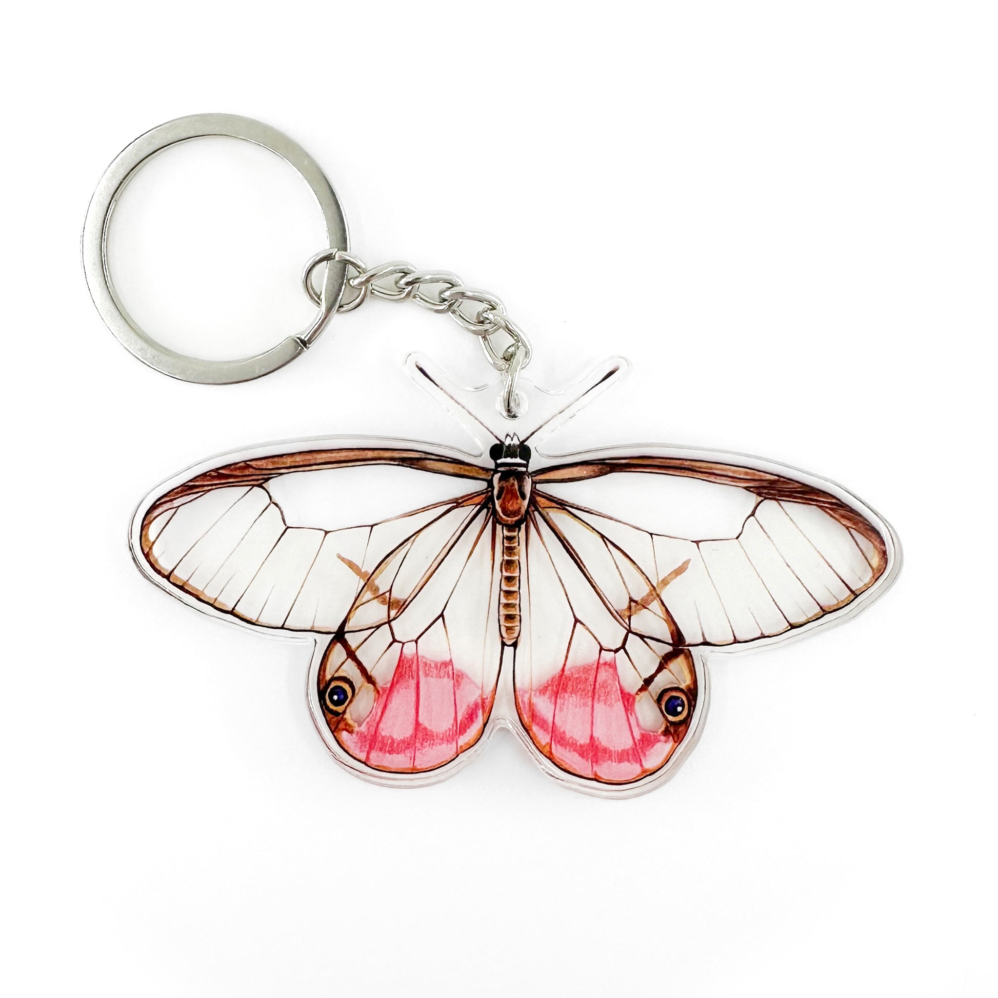 A keychain featuring an illustration of a blushing phantom butterfly 