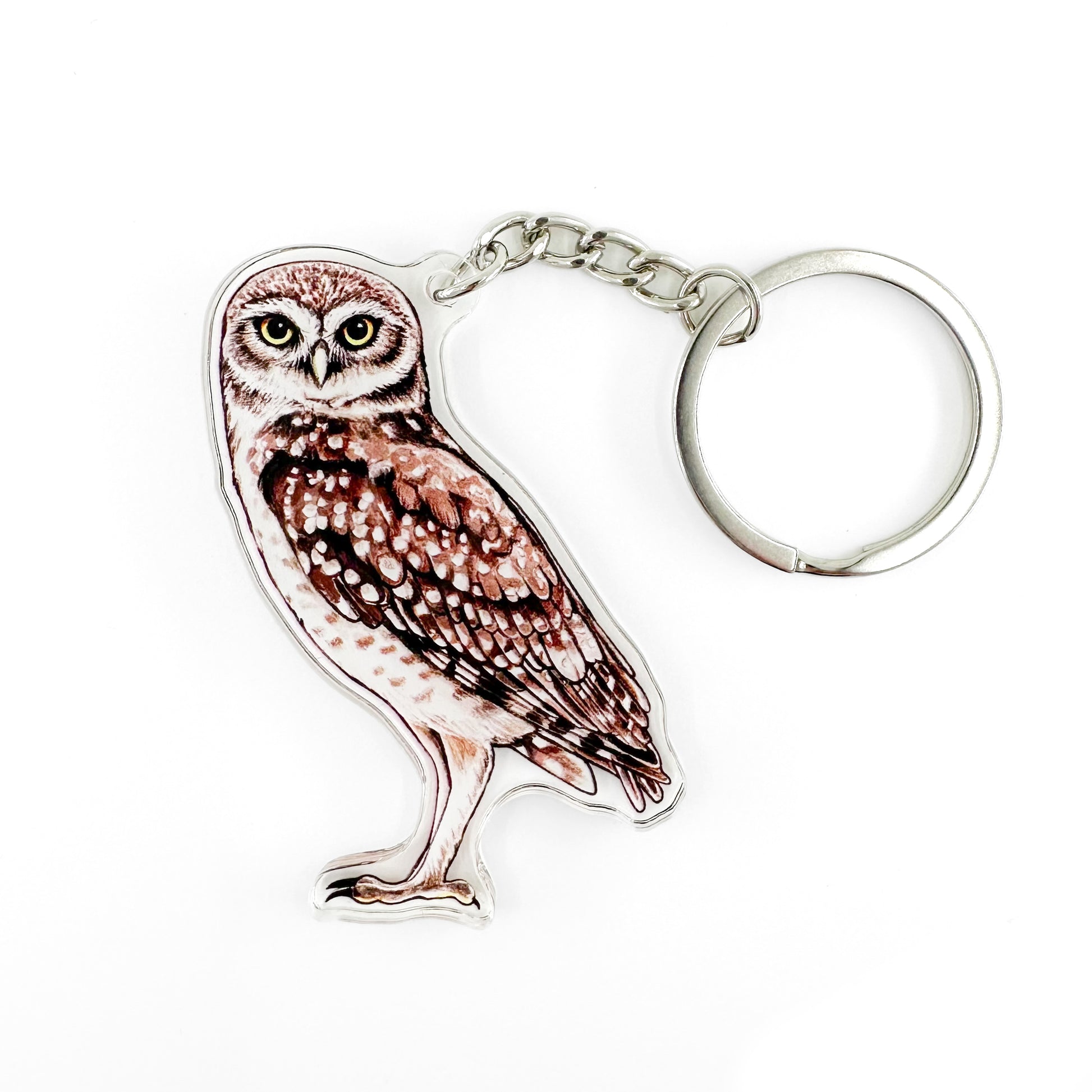 A keychain featuring an illustration of a burrowing owl