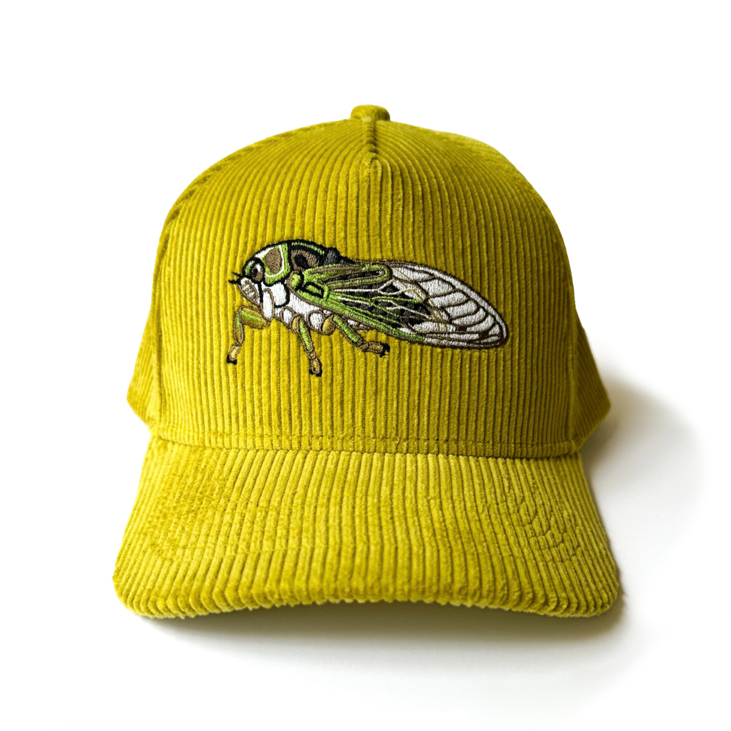 Greenish-yellow cap with an embroidered cicada on a white background