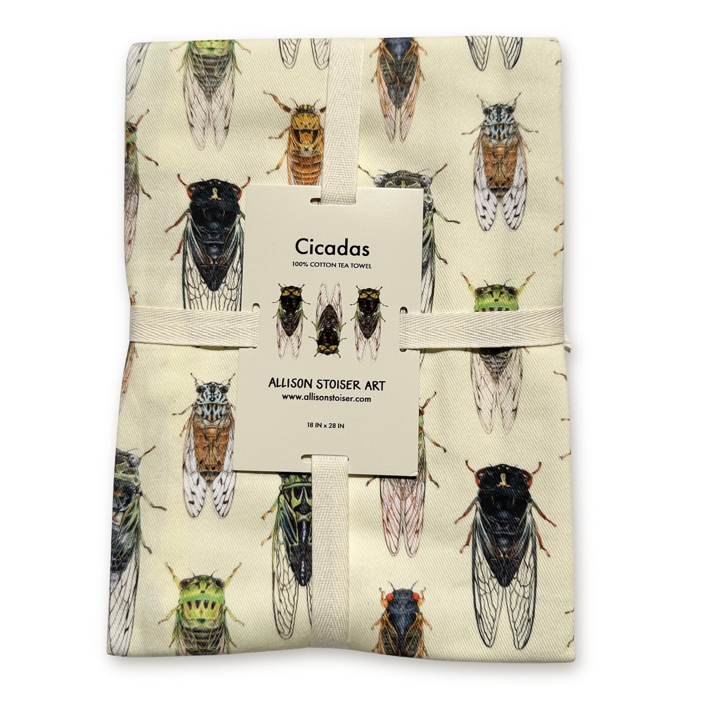 A folded tea towel print featuring cicada illustrations on a cream background, wrapped with a beige ribbon and a white paper tag.