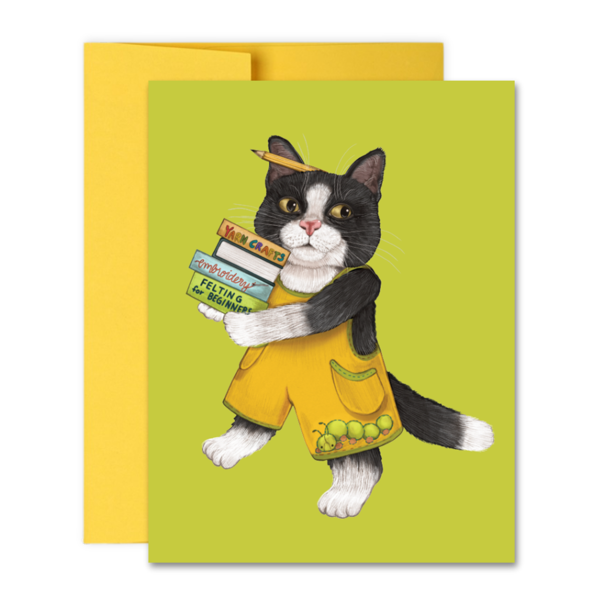A cat carrying a stack of crafting books