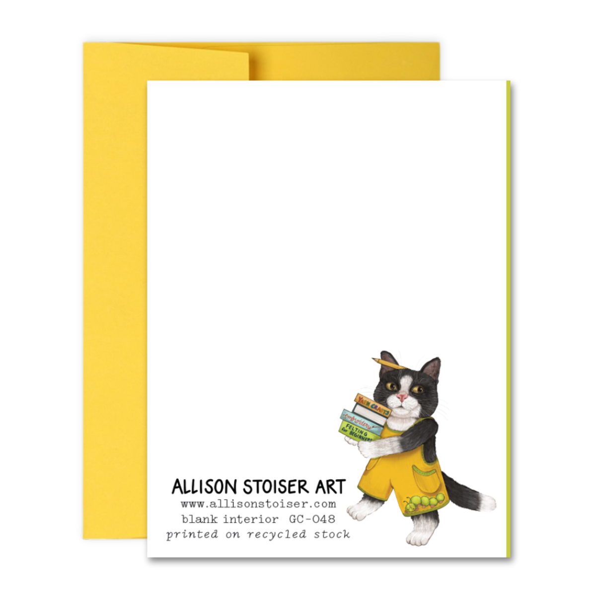 The back of a greeting card featuring a cat carrying a stack of crafting books