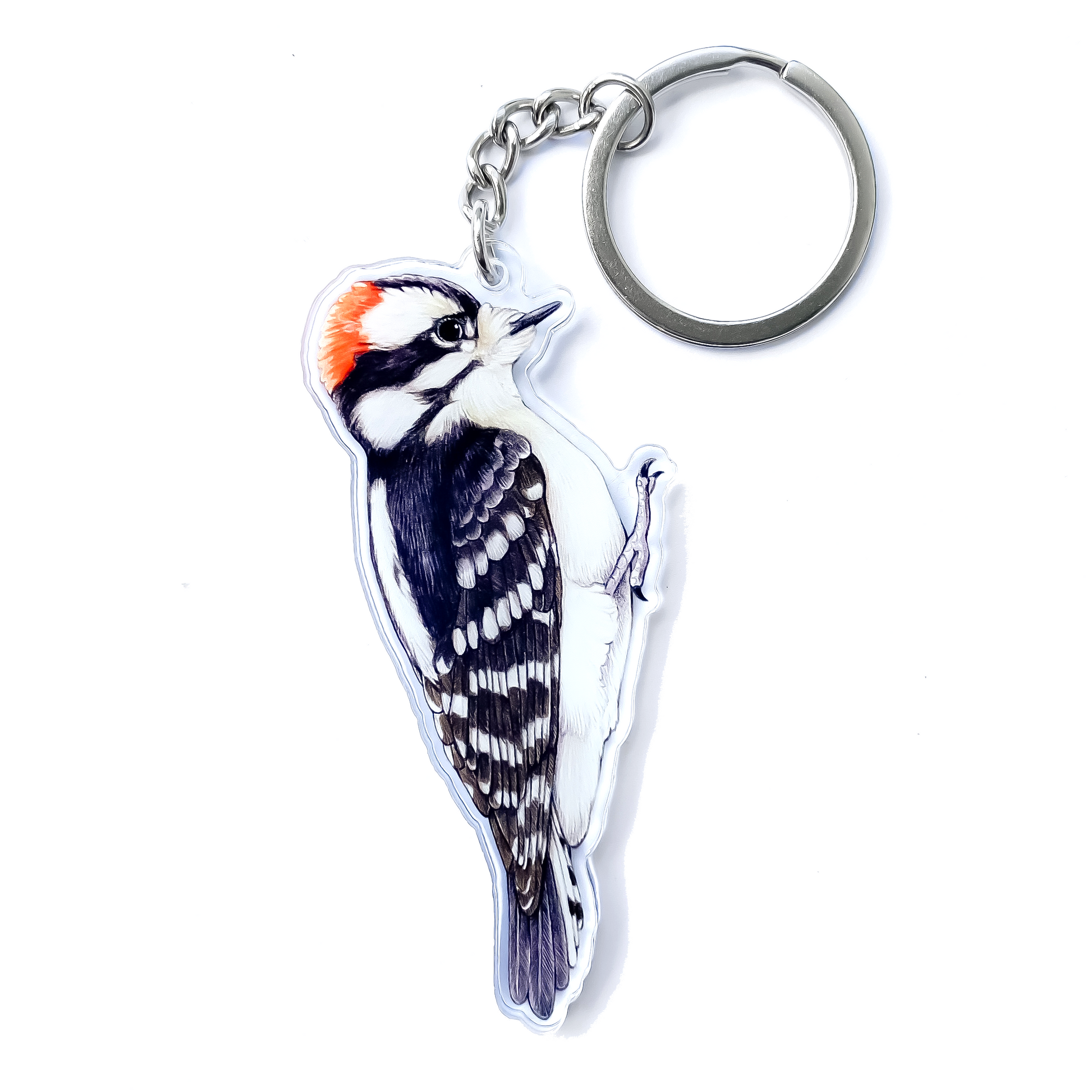 A keychain of a downy woodpecker