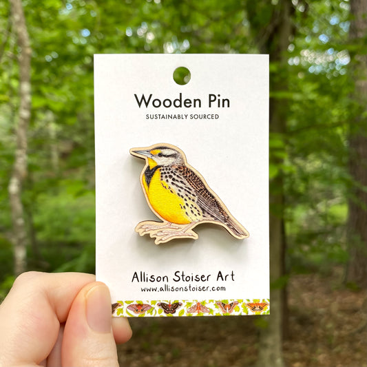 A wooden pin of an eastern Meadowlark