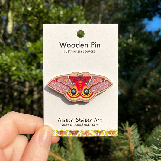 A wooden pin of a female io moth