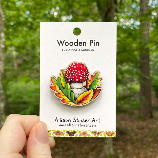 A wooden pin of a fly agaric mushroom