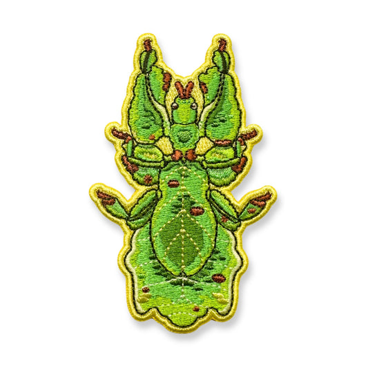 An embroidered patch of a Malaysian leaf insect shown on a plain white background.
