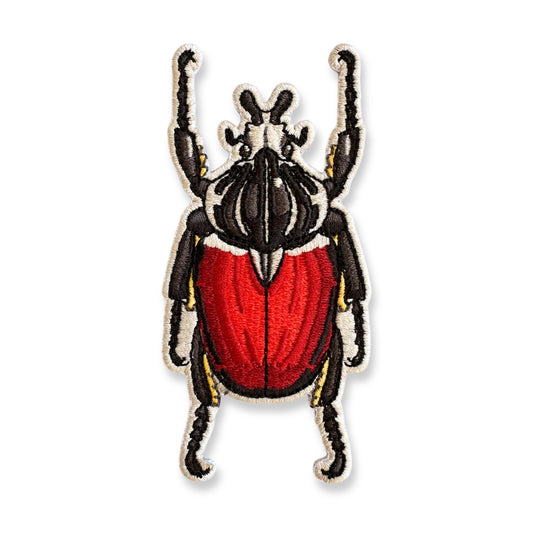 Embroidered patch of a Goliath beetle on a white background