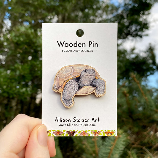 A wooden pin of a gopher tortoise