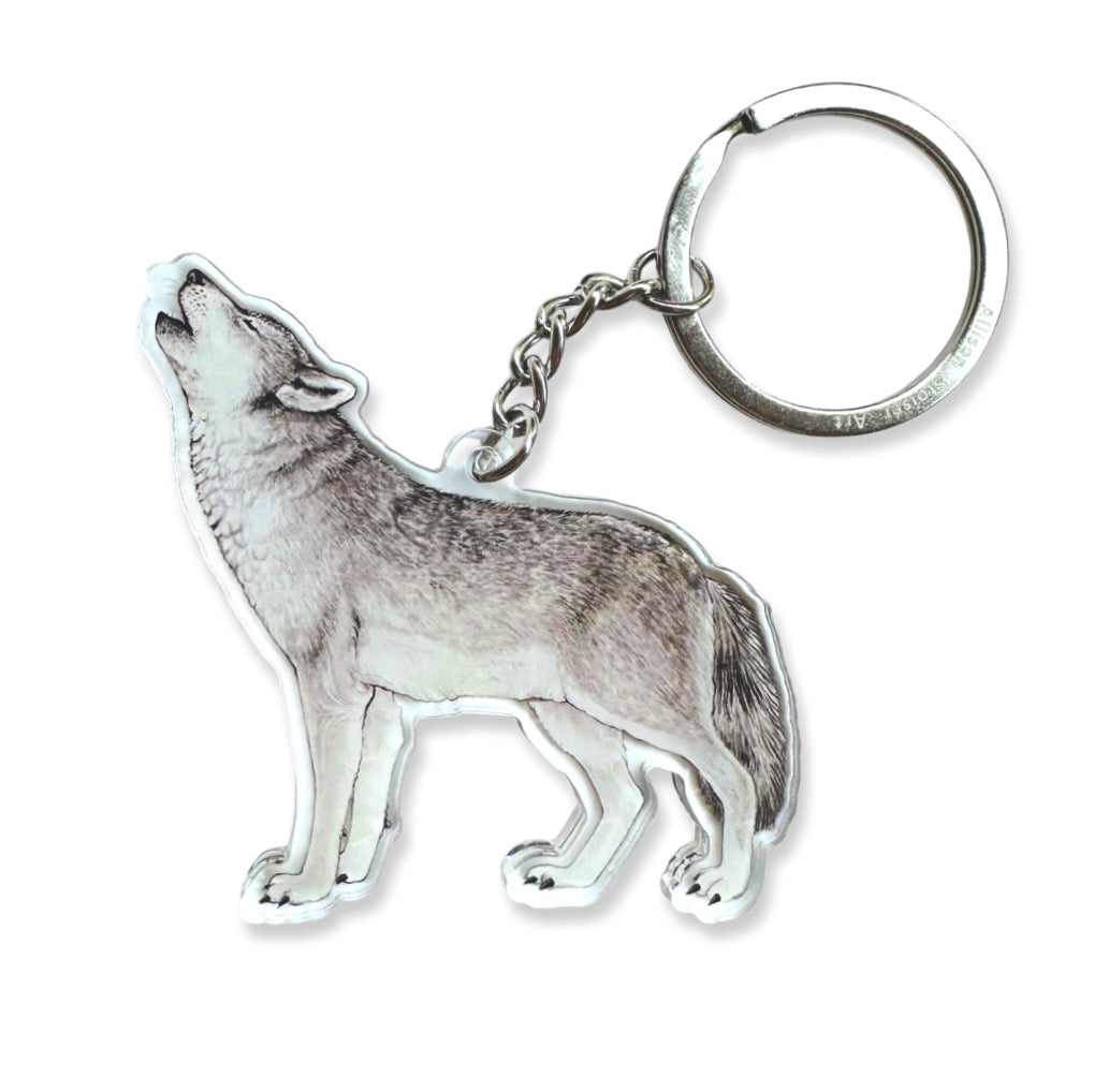 An acrylic keychain of a gray wolf.