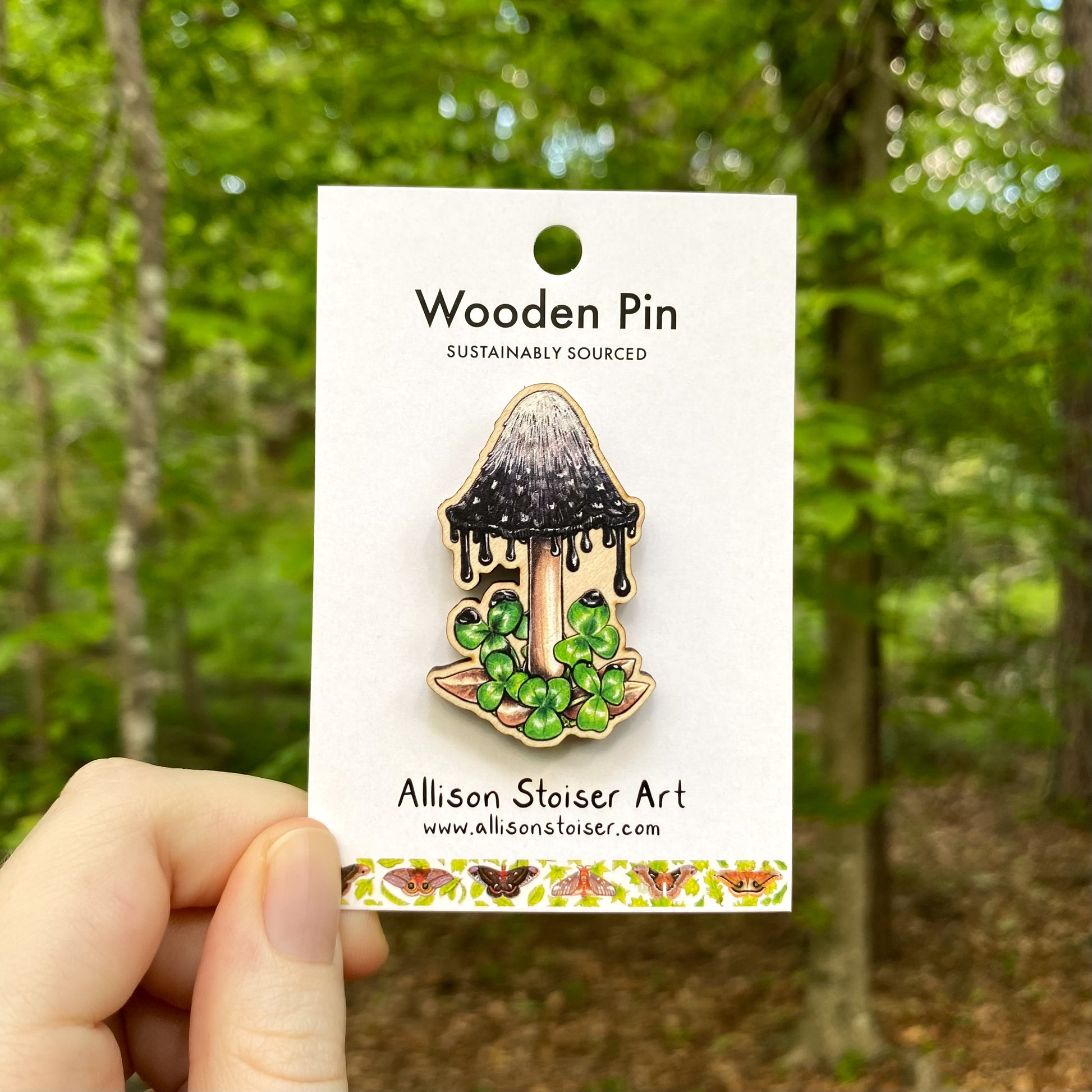 A wooden pin of an inky cap mushroom