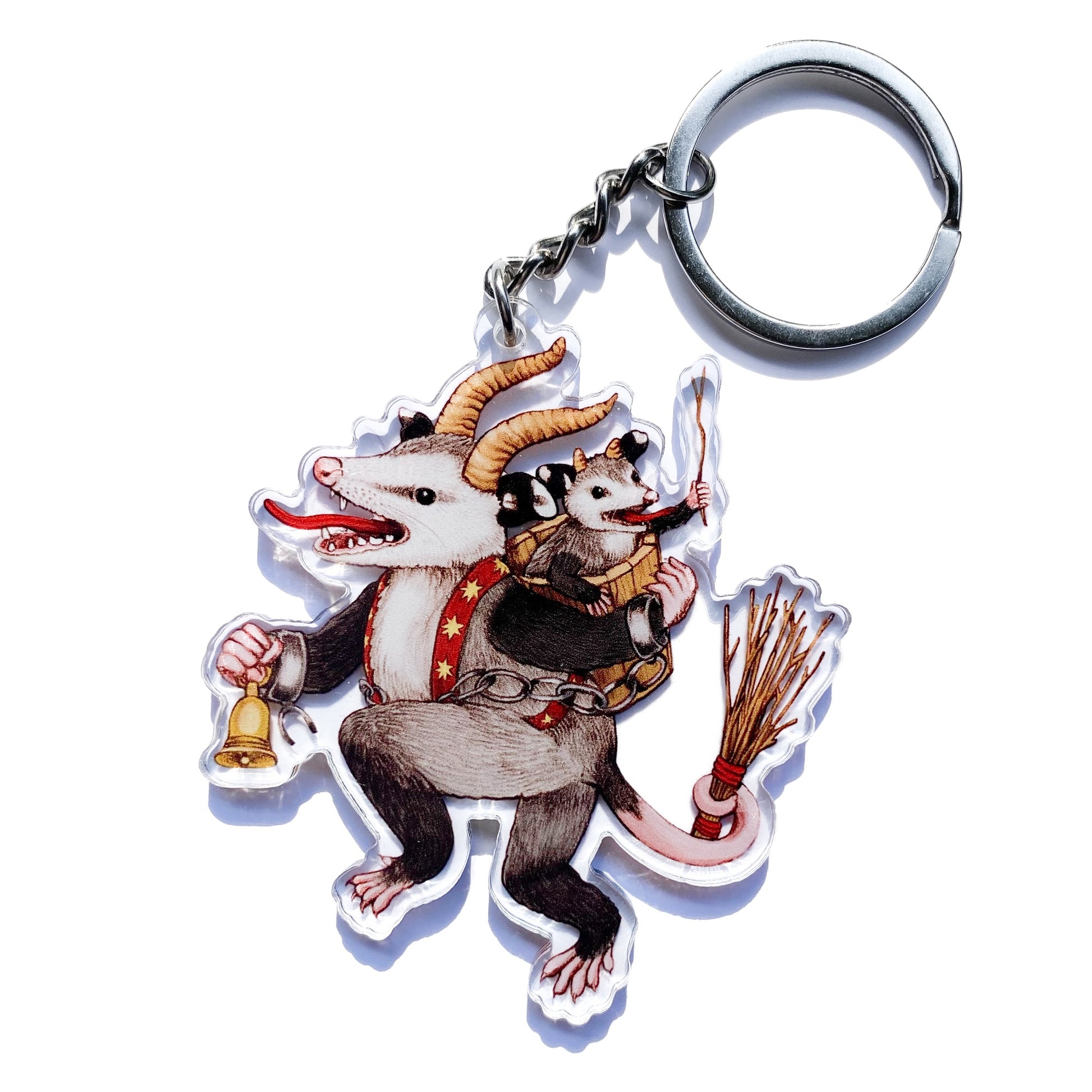 This double-sided acrylic keychain features my illustration of an opossum dressed as Krampus, accompanied by his gleeful little helper.