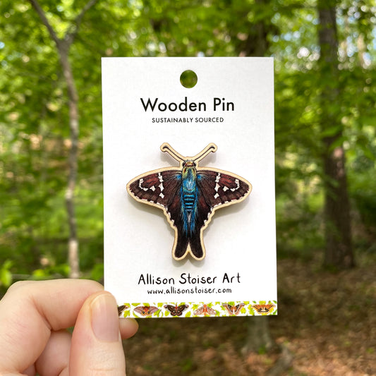 A wooden pin of a long-tailed skipper