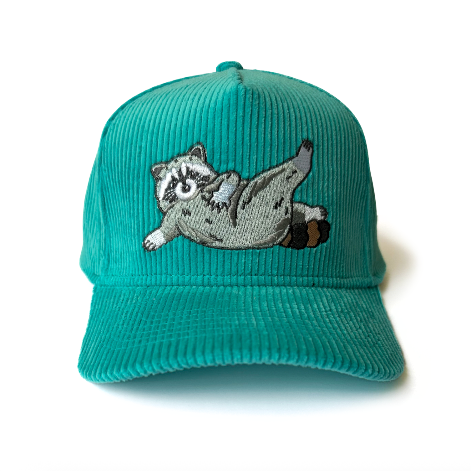 Teal corduroy cap with a raccoon illustration on a white background