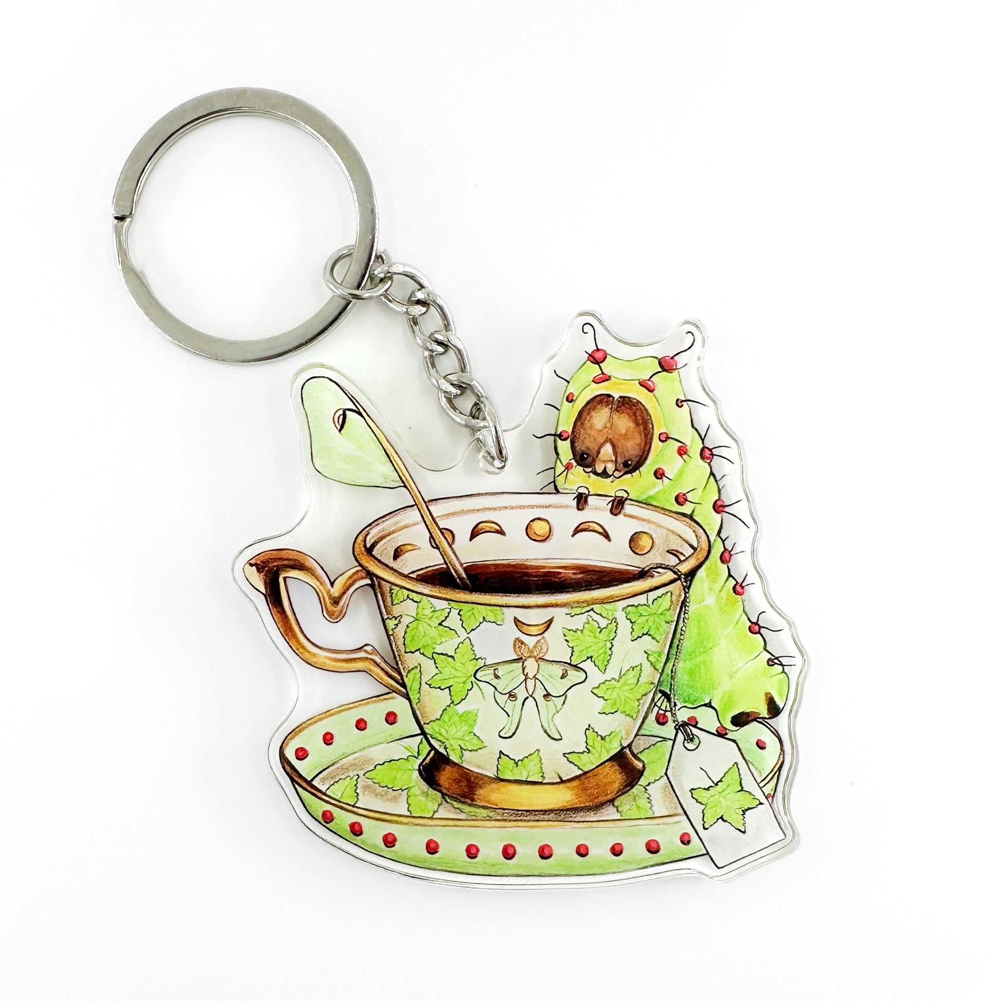 A keychain featuring an illustration of a luna moth