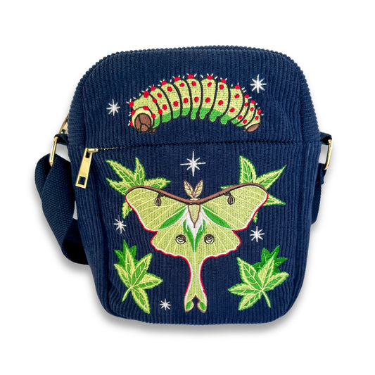 Navy blue corduroy bag with embroidered luna moth and caterpillar on a white background.