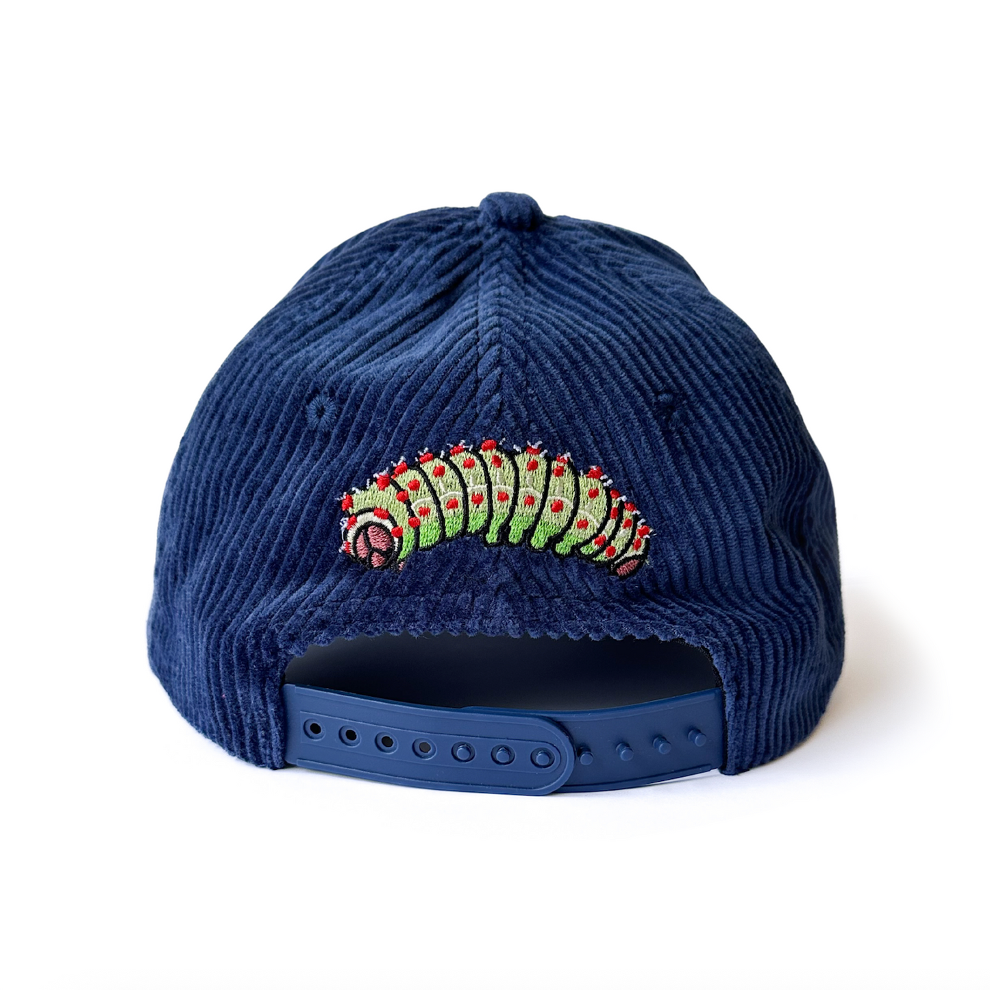 Navy blue corduroy cap with a luna moth caterpillar design on a white background